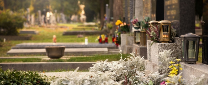 Image of a headstone in a cemetery selected during funeral planning