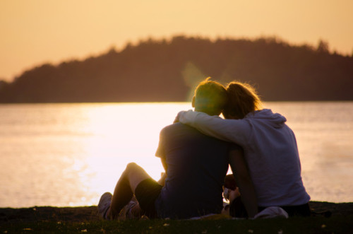 Image of a couple staring out at a lake after completing grief support