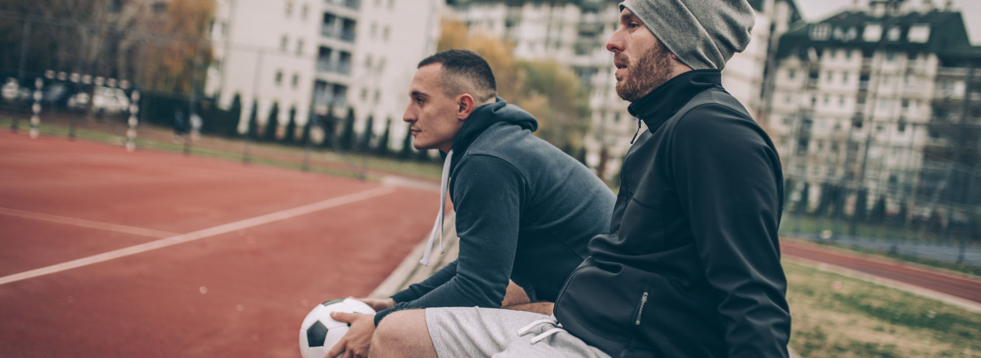 two guys sitting on a bench
